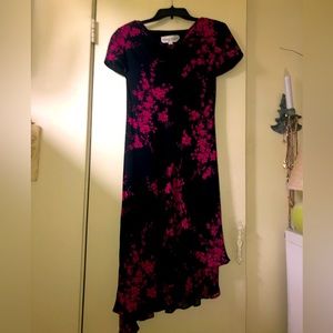 Donna Rocco size 6 black background with bright pink accents.